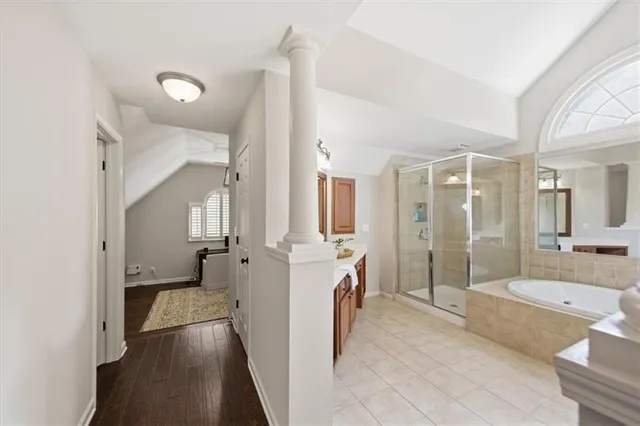 a living room with furniture a rug and white walls