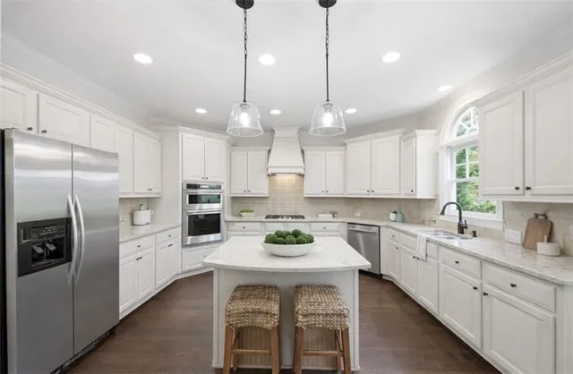 a living room with furniture a table and a large window