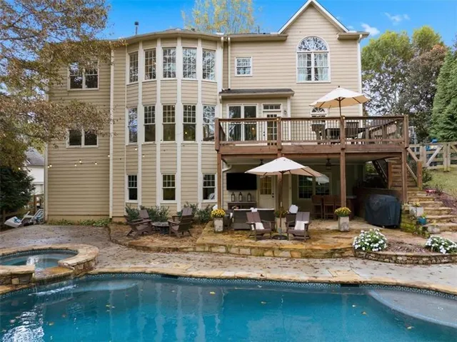 a view of a yard with plants and trees