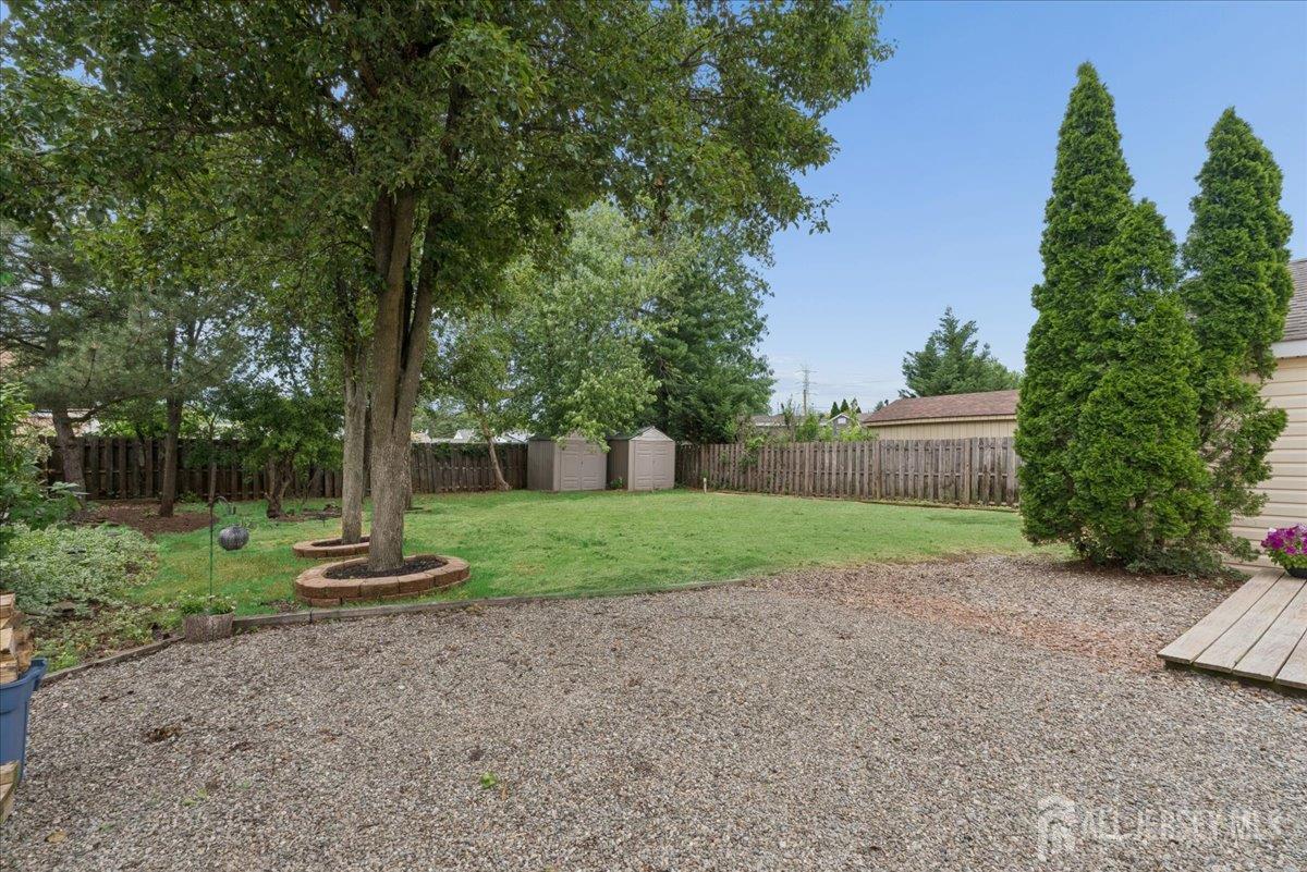 45 Walnut Street Edison, NJ 08817 - Photo 25 of 28 a view of a yard with a tree