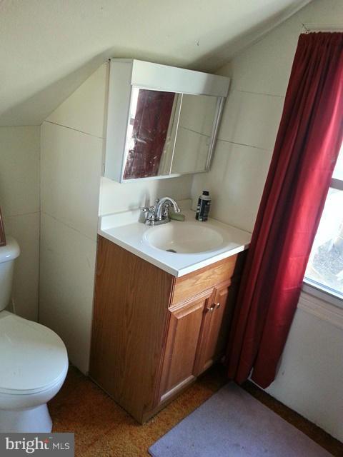 6003 Hill Road St. Leonard, MD 20685 - Photo 11 of 19 a bathroom with a sink and a toilet