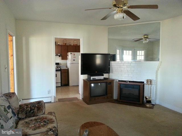 6003 Hill Road St. Leonard, MD 20685 - Photo 17 of 19 a living room with furniture and a flat screen tv