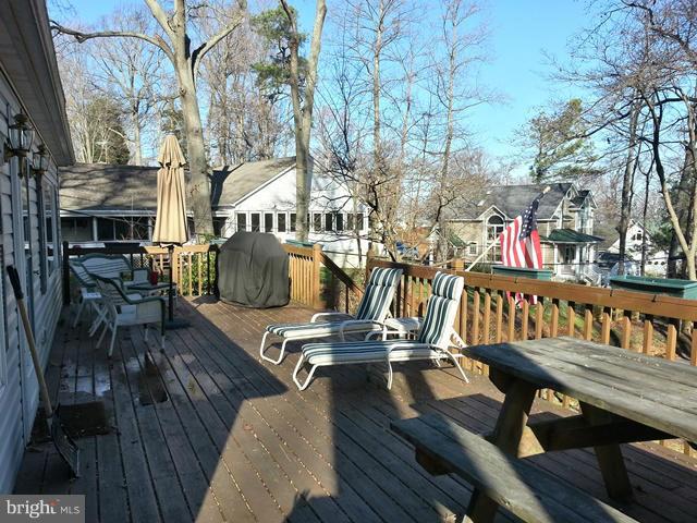 6003 Hill Road St. Leonard, MD 20685 - Photo 3 of 19 a view of a dinning tables and chairs in the patio
