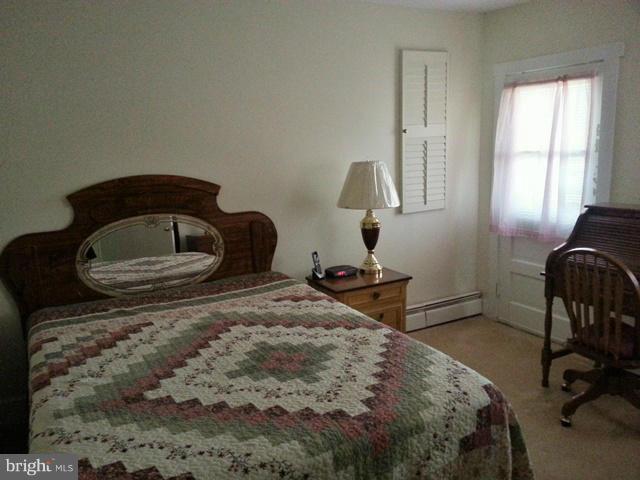 6003 Hill Road St. Leonard, MD 20685 - Photo 8 of 19 a bedroom with a bed and a window