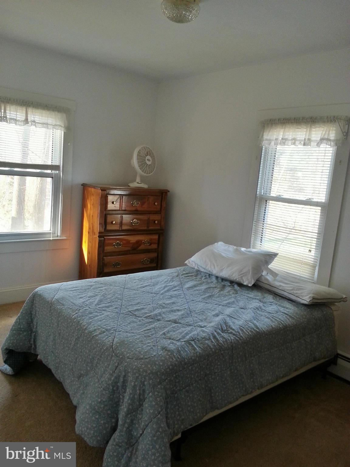 6003 Hill Road St. Leonard, MD 20685 - Photo 9 of 19 a bedroom with a bed and a window