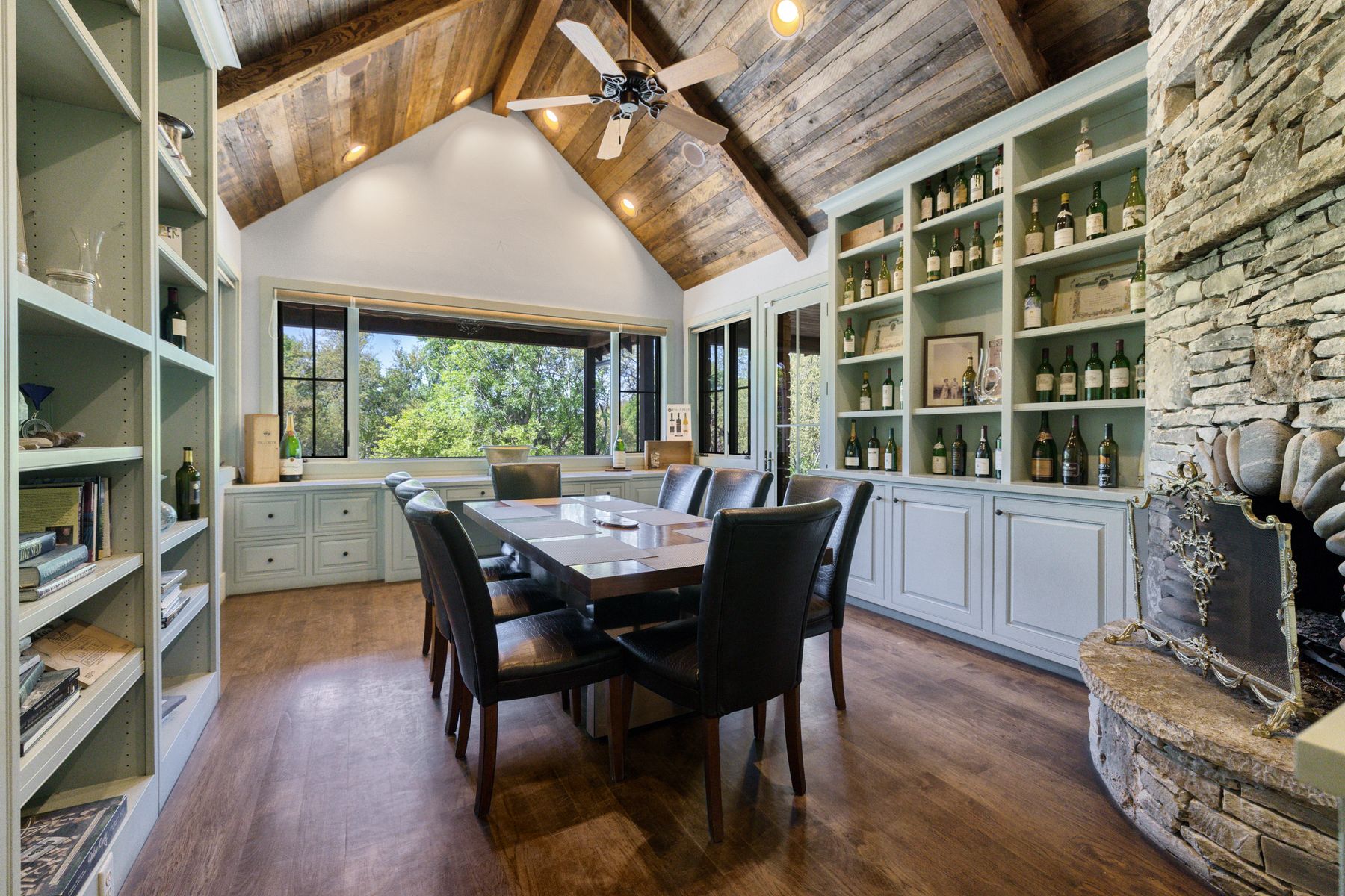 18059 Ranch To Market Road 1826 Buda, TX 78610 - Photo 29 of 39 Dining area featuring built in shelves, a high wooden beamed ceiling, dark wood-style flooring, and a ceiling fan