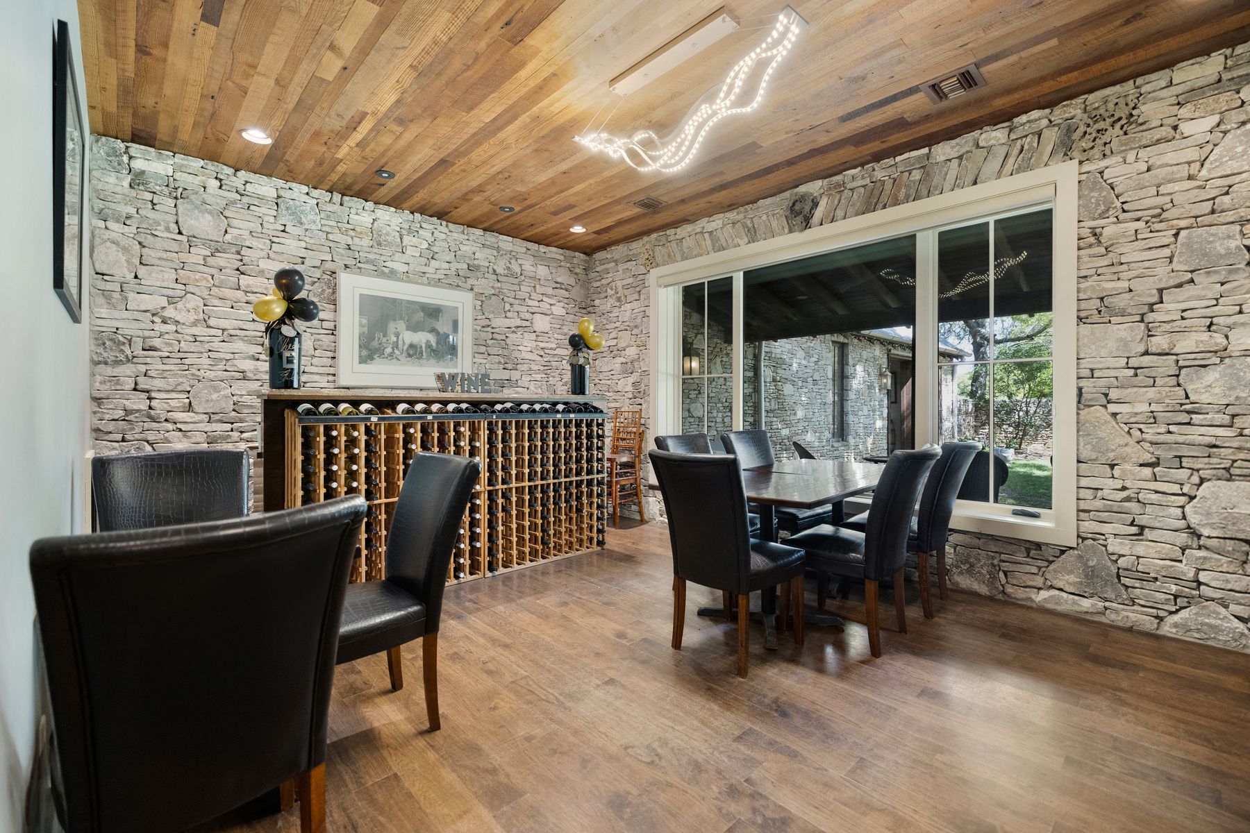 18059 Ranch To Market Road 1826 Buda, TX 78610 - Photo 33 of 39 Dining space featuring wood ceiling and wood finished floors