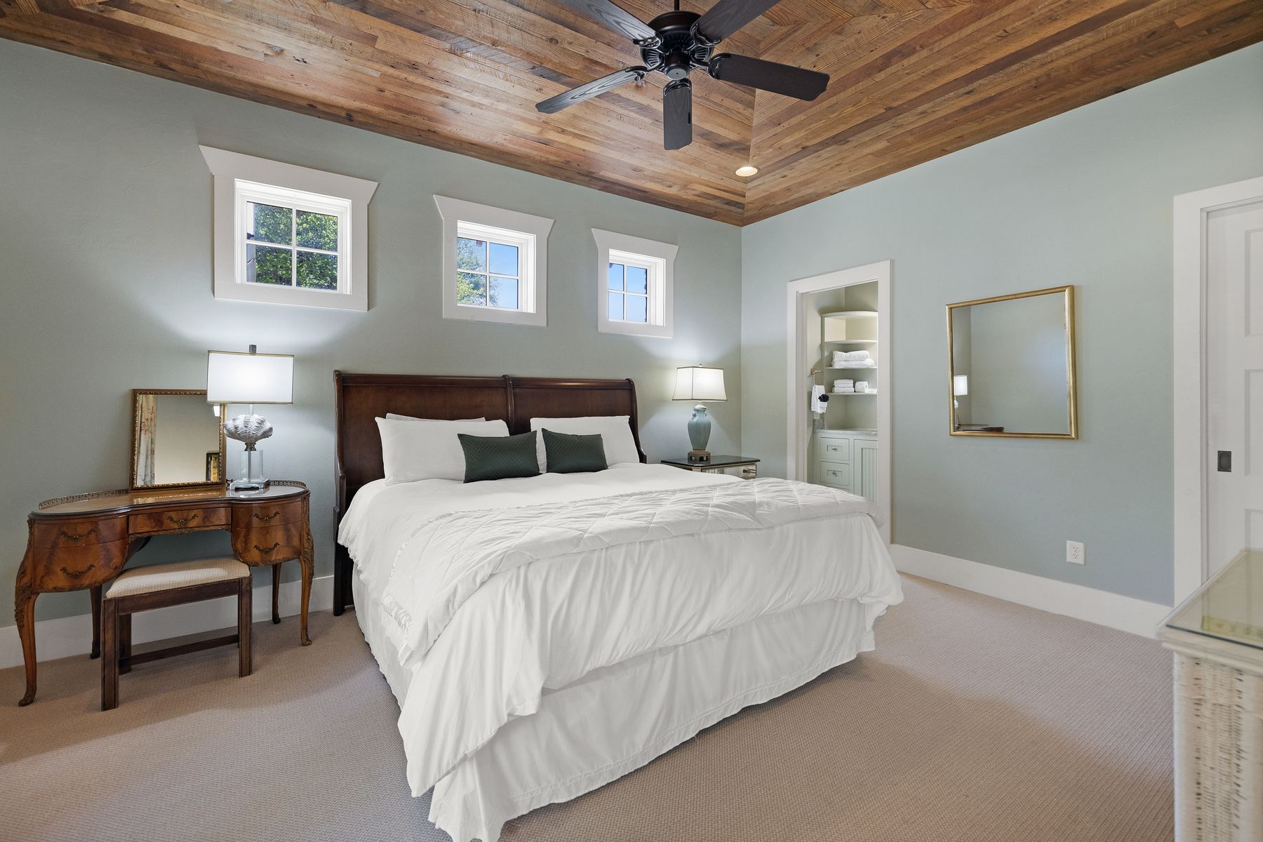 18059 Ranch To Market Road 1826 Buda, TX 78610 - Photo 34 of 39 Bedroom with wood ceiling, carpet, connected bathroom, and a ceiling fan