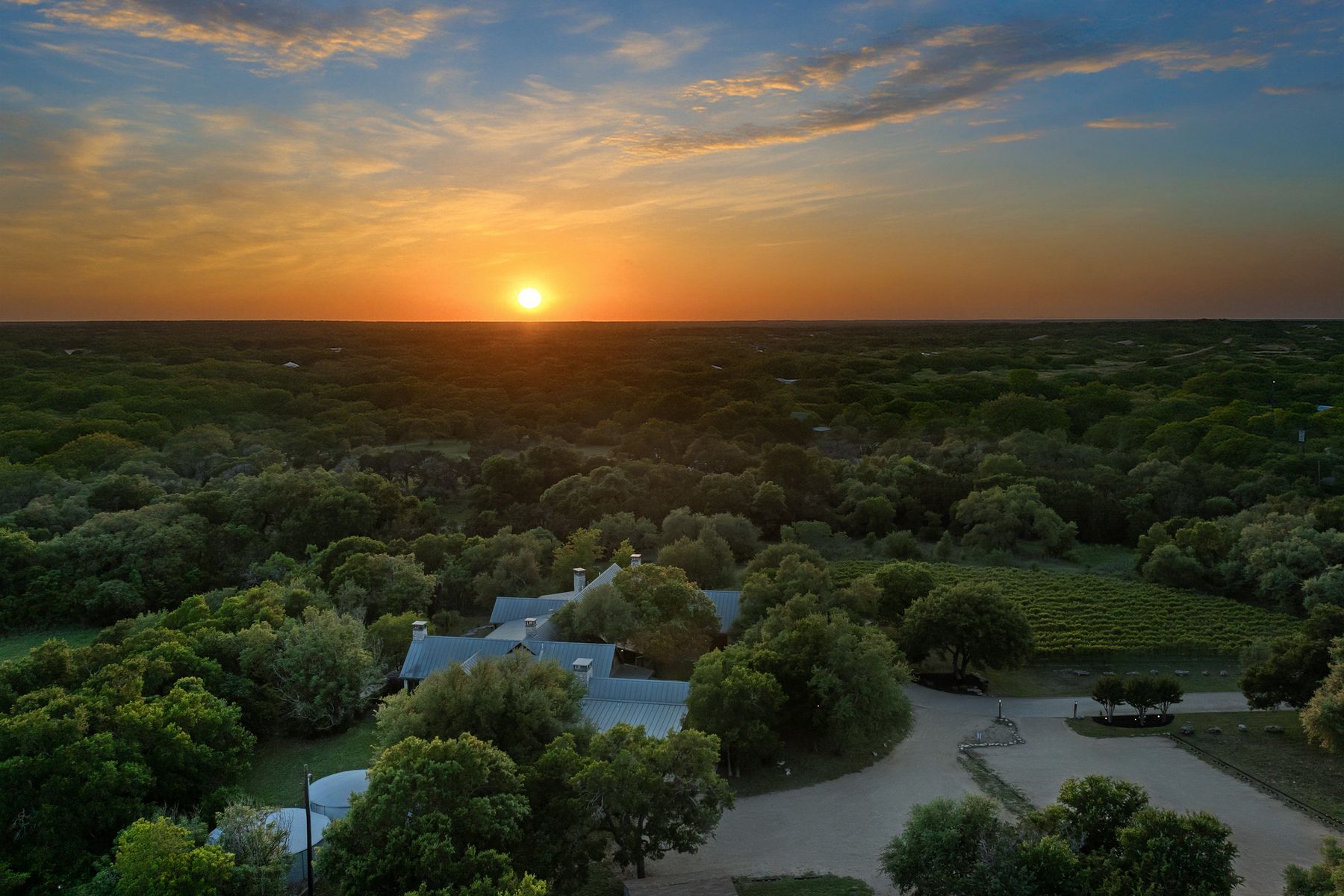 18059 Ranch To Market Road 1826 Buda, TX 78610 - Photo 4 of 39 Aerial view at dusk of a wooded view