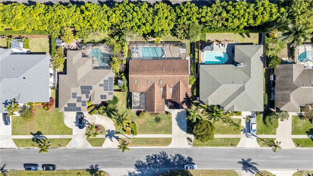 2419 Pinewoods Circle, Unit 11 Naples, FL 34105 - Photo 28 of 32 aerial view of a house with a yard