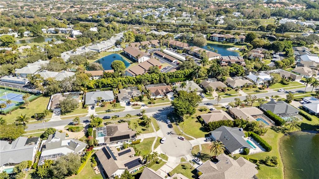 2419 Pinewoods Circle, Unit 11 Naples, FL 34105 - Photo 29 of 32 an aerial view of residential houses with outdoor space