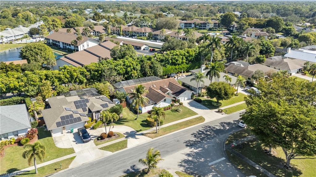 2419 Pinewoods Circle, Unit 11 Naples, FL 34105 - Photo 30 of 32 an aerial view of residential houses with outdoor space