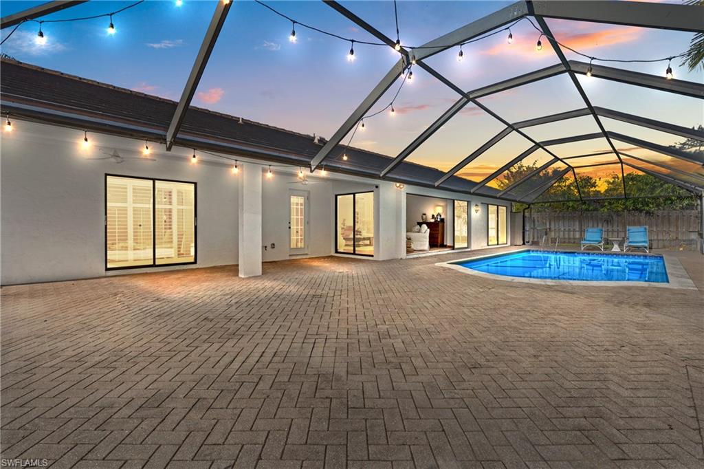 2419 Pinewoods Circle, Unit 11 Naples, FL 34105 - Photo 6 of 32 a view of a livingroom with a fireplace and window