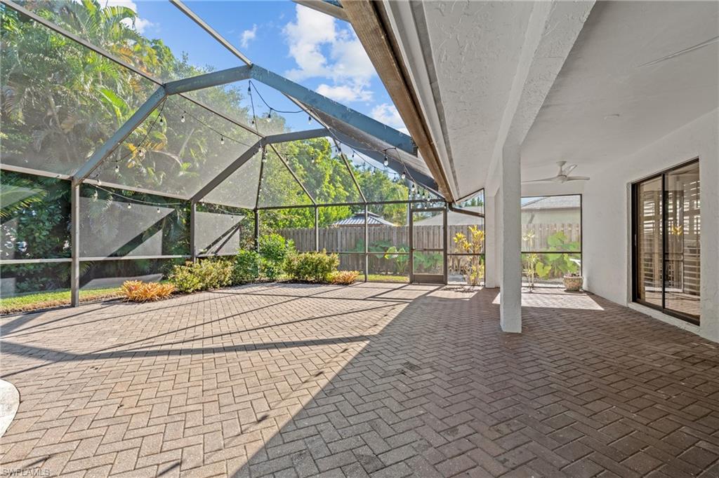 2419 Pinewoods Circle, Unit 11 Naples, FL 34105 - Photo 8 of 32 a house with a outdoor space