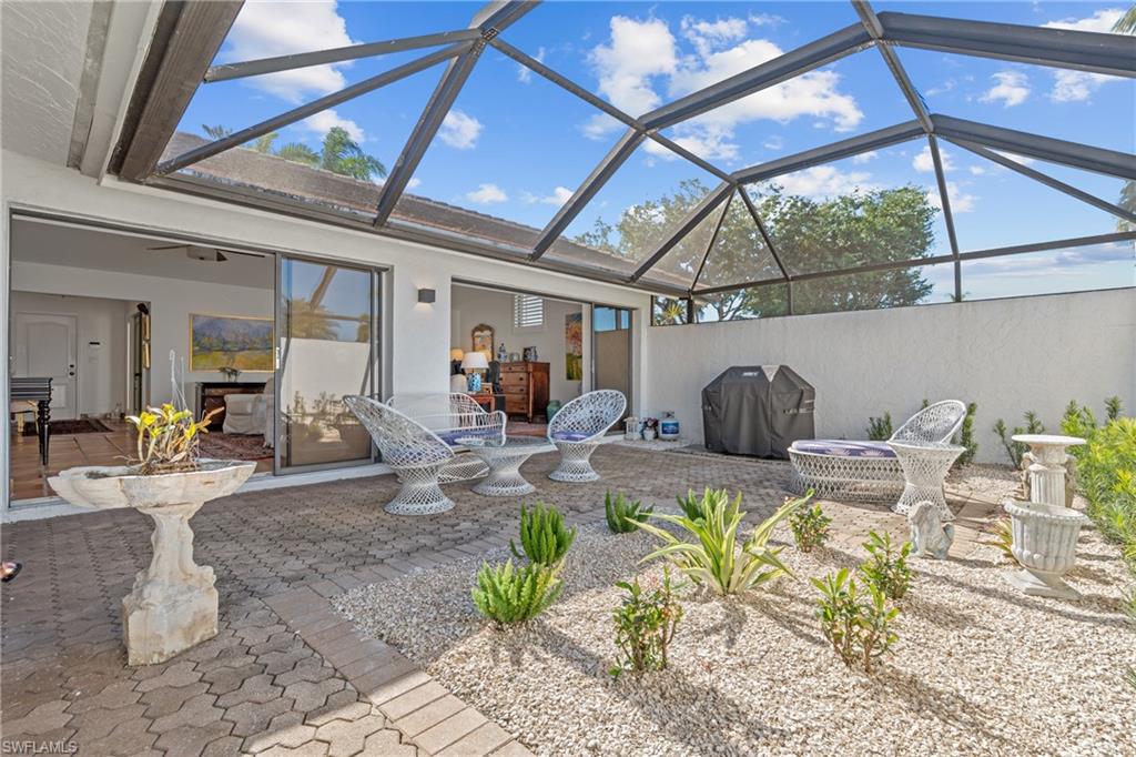 2419 Pinewoods Circle, Unit 11 Naples, FL 34105 - Photo 10 of 32 a view of a dining room with furniture