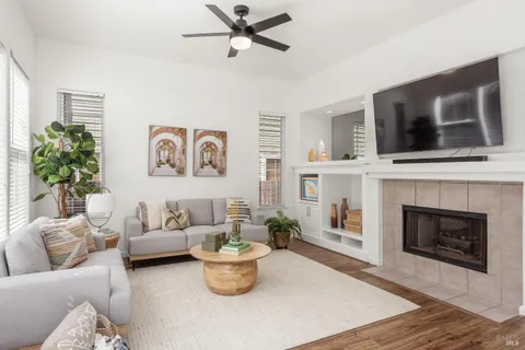 a kitchen with stainless steel appliances kitchen island granite countertop a refrigerator and a stove top oven
