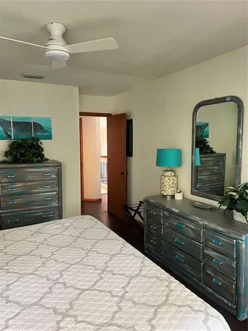 a bedroom with a bed and a dresser