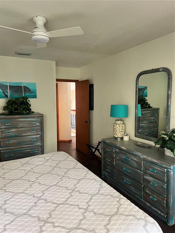 10 Oakmont Court, Unit 10 Palm Coast, FL 32137 - Photo 11 of 19 a bedroom with a bed and a dresser