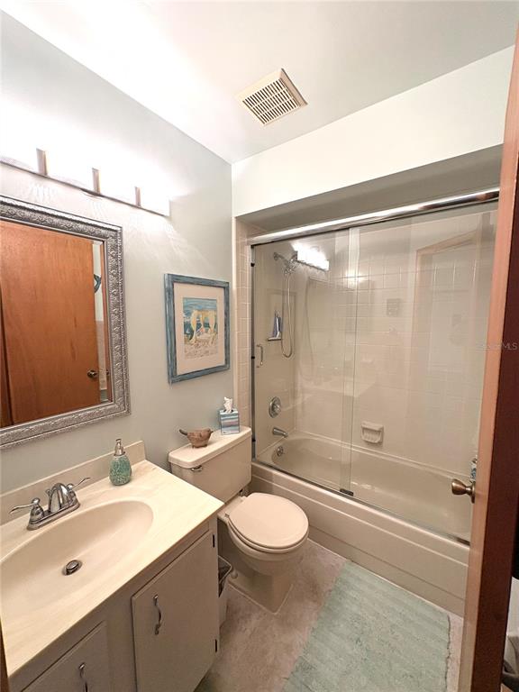 10 Oakmont Court, Unit 10 Palm Coast, FL 32137 - Photo 18 of 19 a bathroom with a sink a toilet and shower