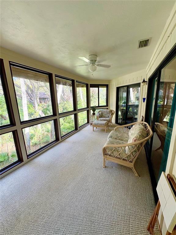 10 Oakmont Court, Unit 10 Palm Coast, FL 32137 - Photo 19 of 19 a spacious bedroom with a large bed and a large window