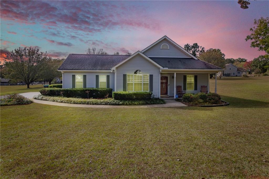 670 Laney Road Locust Grove, GA 30248 - Photo 1 of 1 a front view of a house with a garden