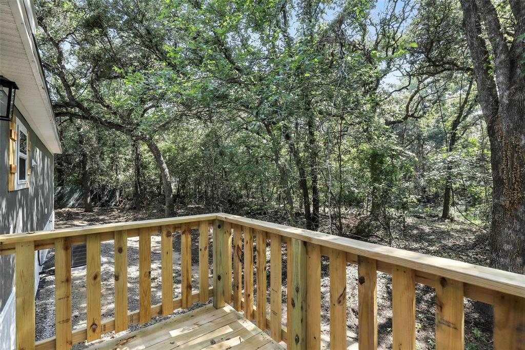 131 Kelly Court Azle, TX 76020 - Photo 20 of 22 a view of a wooden fence