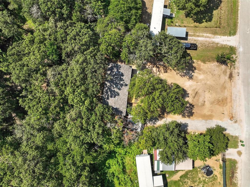 131 Kelly Court Azle, TX 76020 - Photo 21 of 22 a backyard of a house with lots of green space