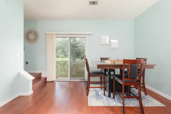 a kitchen with stainless steel appliances a stove refrigerator sink and microwave