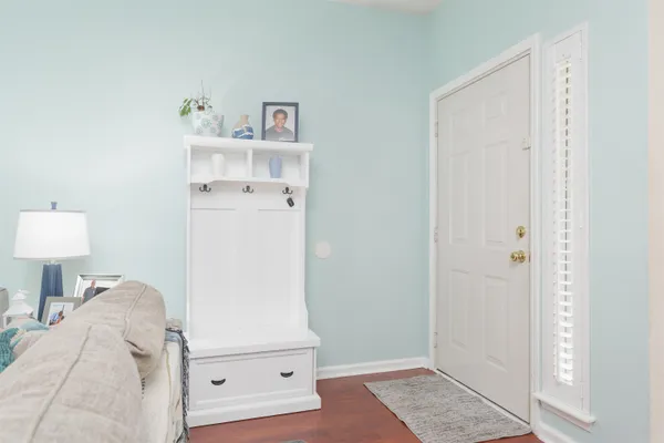 an aerial view of a house with a garden and lake view