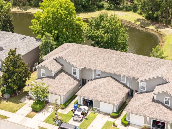 a view of an entryway with wooden floor and furniture
