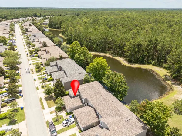 an aerial view of residential houses with outdoor space