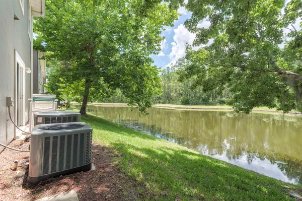 an aerial view of a house with a swimming pool patio and outdoor seating