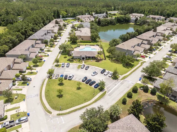 an aerial view of residential houses with outdoor space