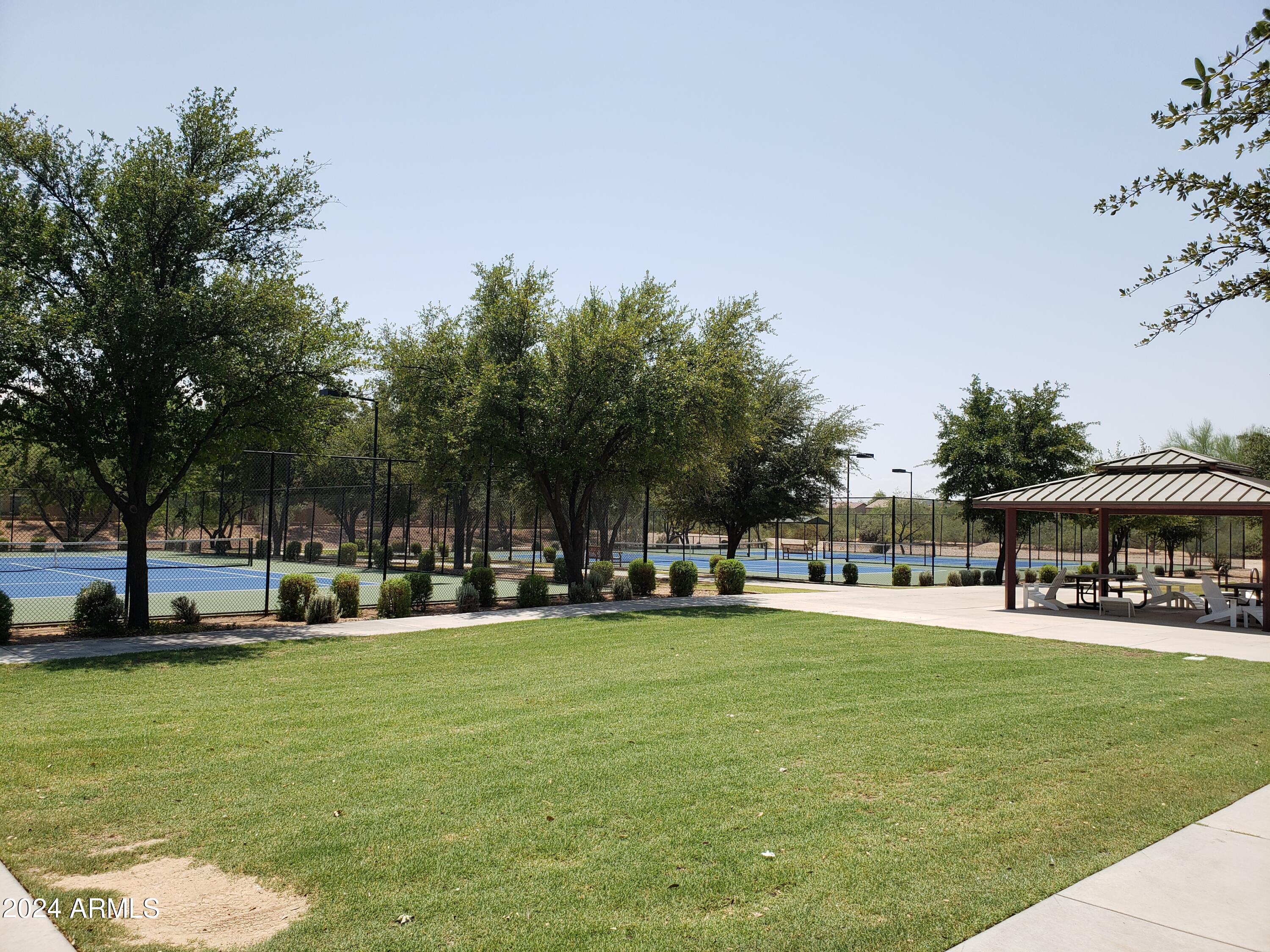 8426 West Gehrig Way Florence, AZ 85132 - Photo 46 of 46 a swimming pool view with a seating space and a garden