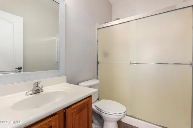 an empty room with windows and closet