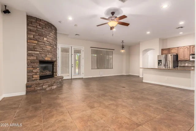 a view of a kitchen with furniture and a ceiling fan