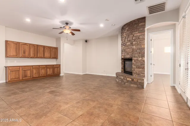 a large kitchen with stainless steel appliances and a refrigerator