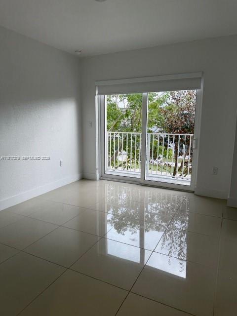 25870 Southwest 144th Court Homestead, FL 33032 - Photo 19 of 46 a view of an empty room with a window