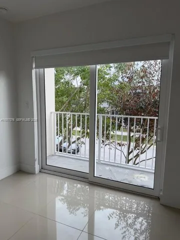 a view of an empty room and window