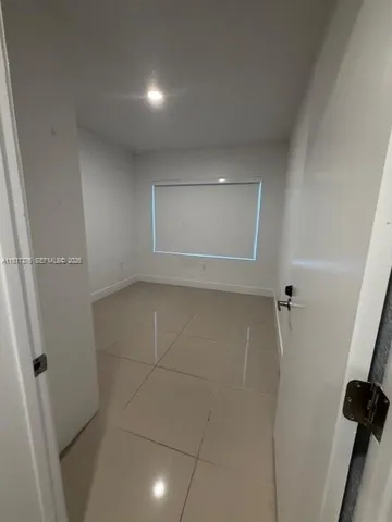 an empty room with a bathroom