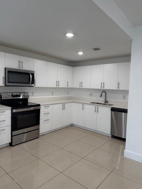 25870 Southwest 144th Court Homestead, FL 33032 - Photo 3 of 46 a kitchen with a stove sink and cabinets