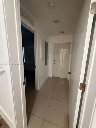 a bathroom with a sink and mirror with toilet