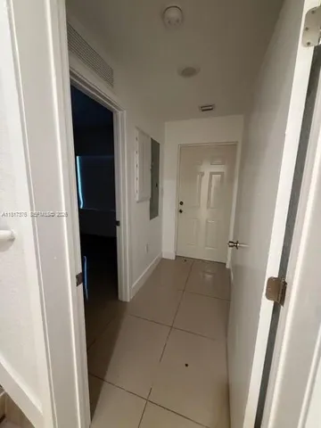 a bathroom with a sink and mirror with toilet
