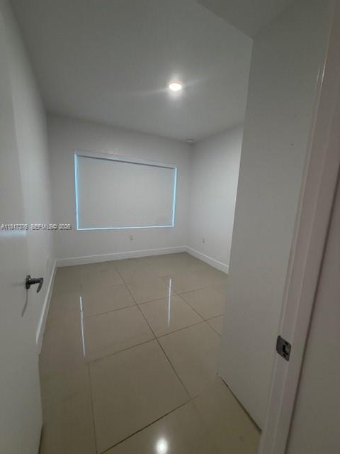 25870 Southwest 144th Court Homestead, FL 33032 - Photo 34 of 46 an empty room with a empty space and windows