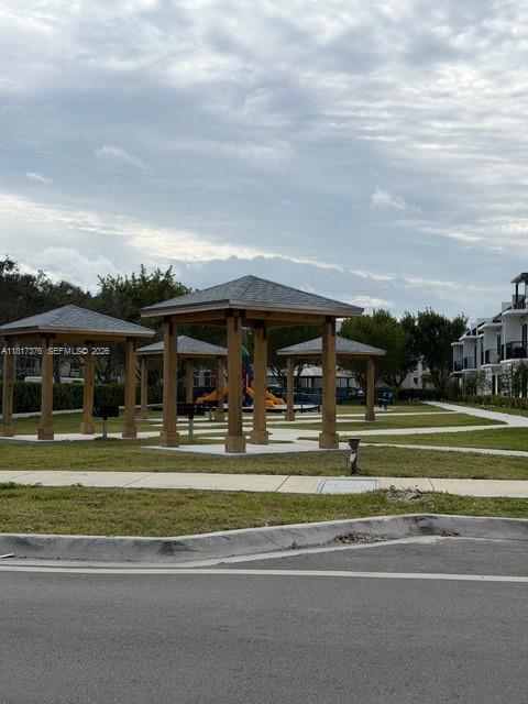 25870 Southwest 144th Court Homestead, FL 33032 - Photo 46 of 46 a view of big building with a big yard and plants