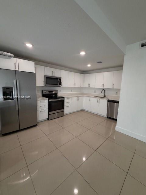 25870 Southwest 144th Court Homestead, FL 33032 - Photo 6 of 46 a large kitchen with a cabinets and stainless steel appliances