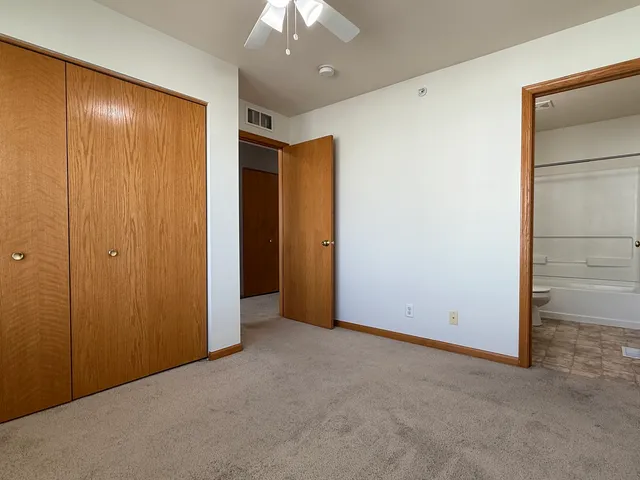 an empty room with closet area