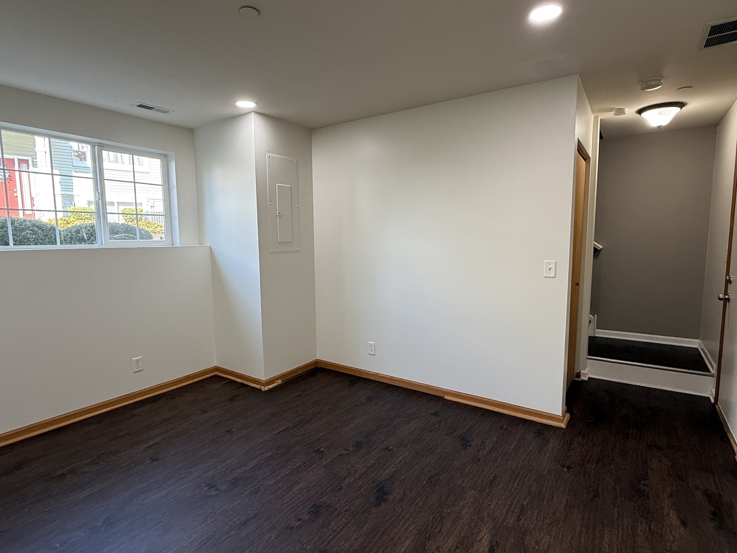 1392 Carolyn Court Yorkville, IL 60560 - Photo 23 of 23 an empty room with wooden floor and windows