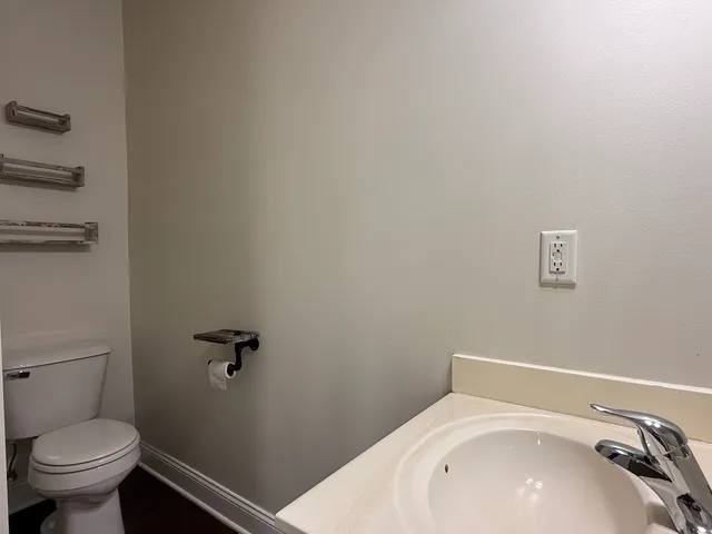 a bathroom with a sink and toilet