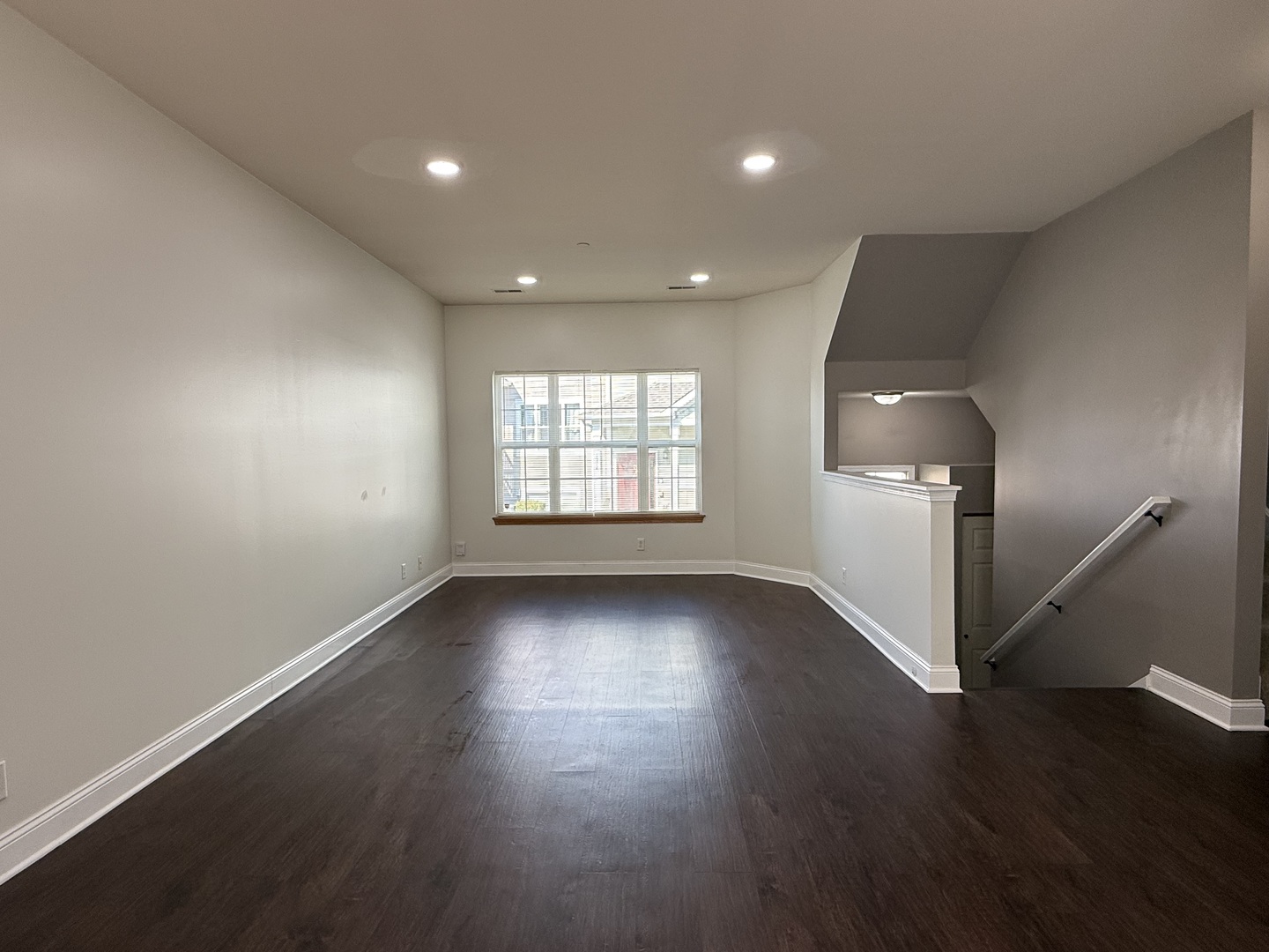 1392 Carolyn Court Yorkville, IL 60560 - Photo 8 of 23 an empty room with wooden floor and windows